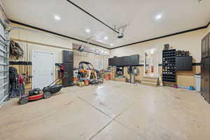 Garage with recessed lighting and a garage door opener