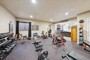 Exercise room with rubber floors and recessed lighting