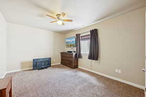 Bedroom featuring carpet and ceiling fan