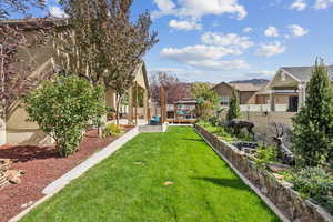 Fenced backyard with a gazebo and a patio area