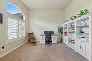 Office featuring light colored carpet and baseboards