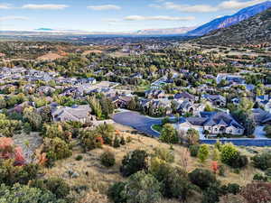Aerial view of residential area featuring a mountainous background
