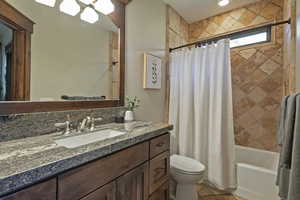 Full bath with shower / tub combo and vanity