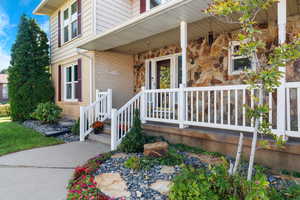 Property entrance with covered porch