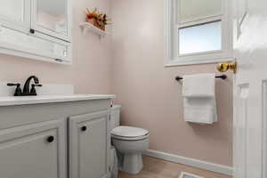 Bathroom featuring light wood finished floors and vanity