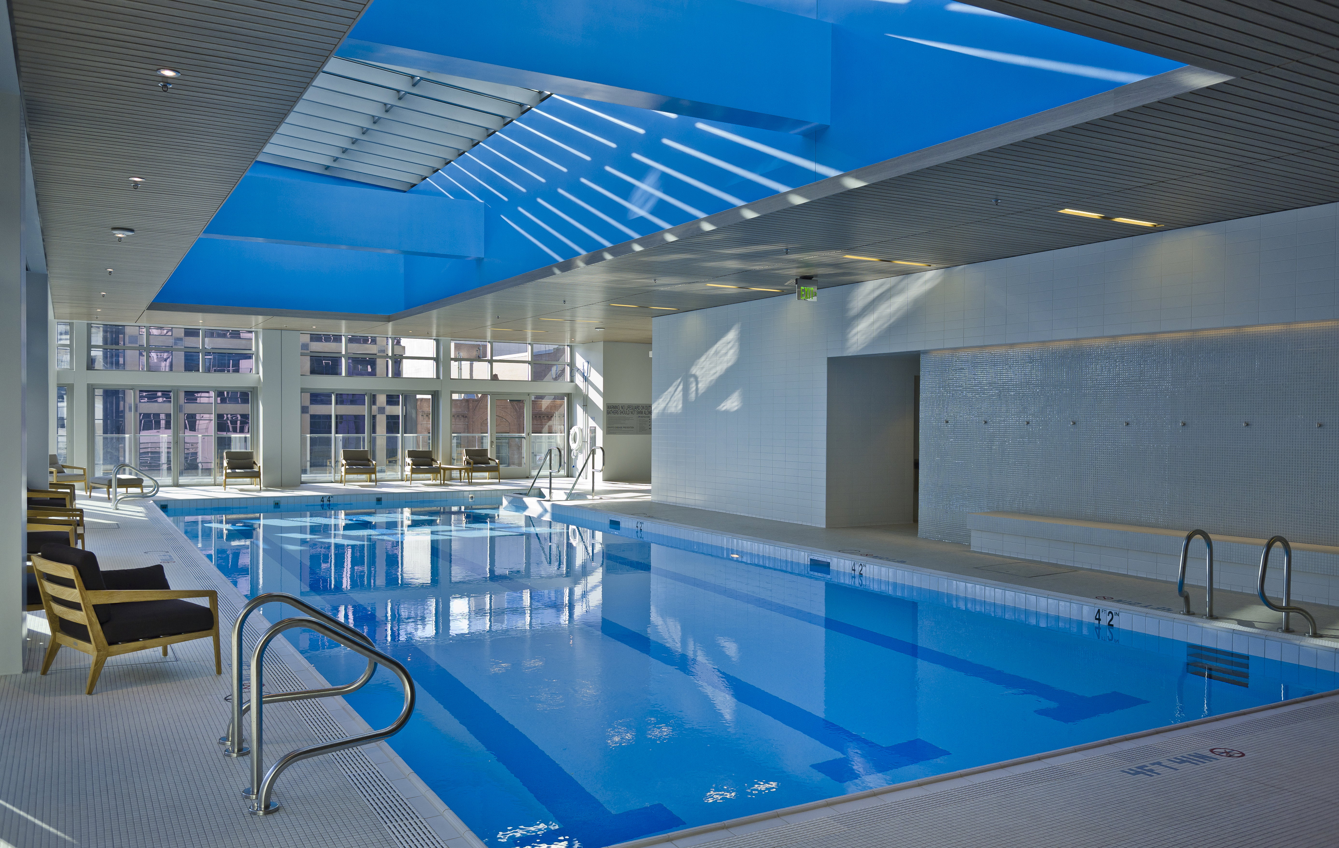 Indoor pool featuring a patio area