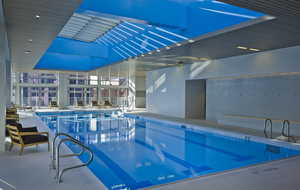 Indoor pool featuring a patio area