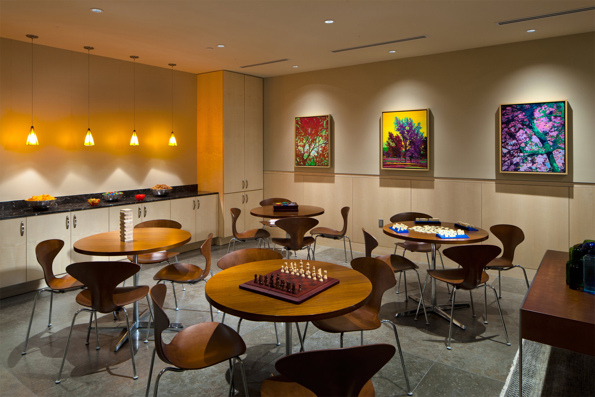Dining area featuring recessed lighting, a decorative wall, and a wainscoted wall