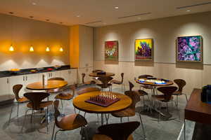Dining area featuring recessed lighting, a decorative wall, and a wainscoted wall