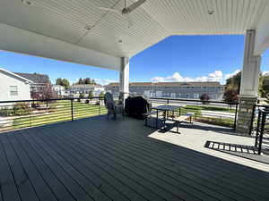 Deck featuring a residential view and ceiling fan