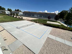 Surrounding community featuring a tennis court and a residential view