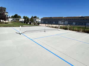 View of community with a residential view and a tennis court