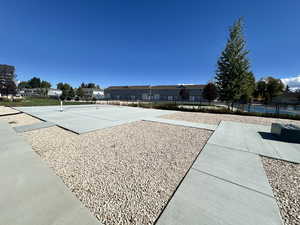 View of community with a tennis court