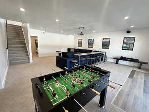 Game room with recessed lighting and a textured ceiling