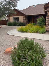 View of front of property featuring a shingled roof
