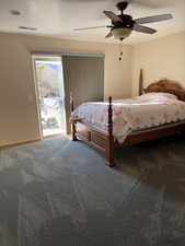 Bedroom with access to outside, carpet floors, and ceiling fan