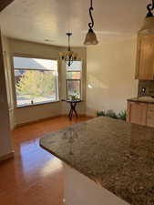 Dining room with light wood-style flooring and baseboards