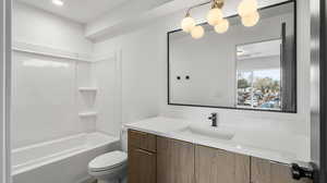 Images shown are of a similar completed unit. Bathroom with vanity and bathtub / shower combination