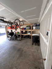 Garage featuring a garage door opener