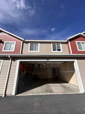 View of front facade featuring a garage
