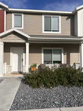 Entrance to property featuring covered porch