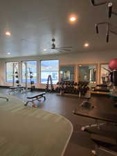 Exercise room featuring recessed lighting and a ceiling fan