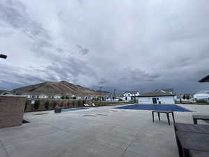 Community pool featuring a residential view and a patio area