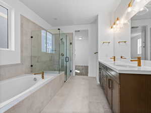 Primary Bathroom with 6 foot soaker tub and full euro glass.