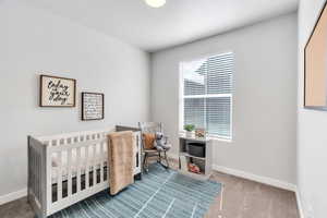 Bedroom #2 is staged as a nursery area