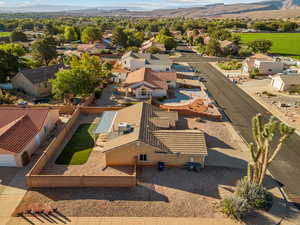 Aerial perspective of suburban area featuring a mountainous background