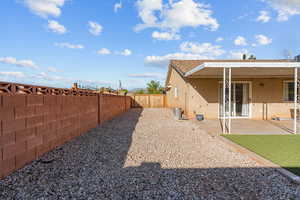 Fenced backyard featuring a patio area
