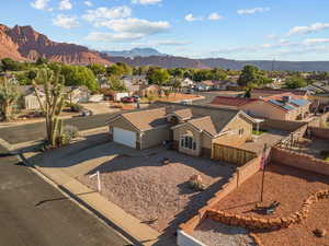 Aerial perspective of suburban area with a mountainous background