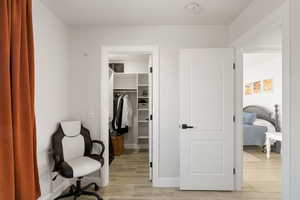 Interior space featuring wood tiled floors and baseboards