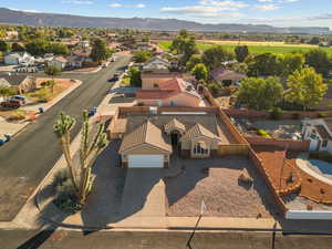 Aerial perspective of suburban area featuring a mountainous background