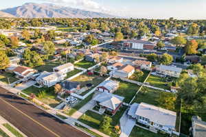 Aerial view of residential area featuring a mountain backdrop