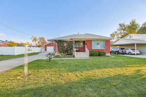 Bungalow featuring brick siding, driveway, covered porch, and a garage