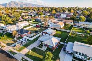 Aerial perspective of suburban area featuring a mountain backdrop