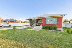 View of front facade featuring brick siding, covered porch, and ceiling fan