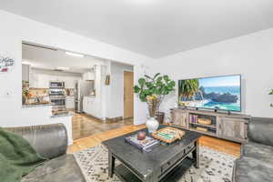 Living area featuring light wood-style flooring