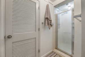 Bathroom featuring a stall shower and tile patterned floors