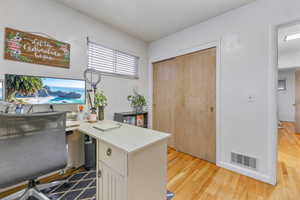Office featuring light wood-style floors