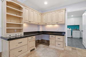 Office area with recessed lighting, built in desk, and stone tile floors.  Perfect for multi gen living or rental