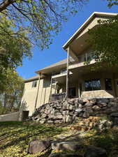 View of patio with a hot tub