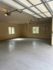 Garage featuring a garage door opener