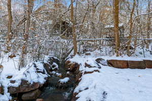 View of snow covered yard from the hot tub.