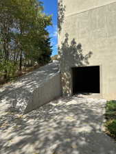 View of side of property with access to the basement high ceiling garage/workroom or whatever you want it to be.