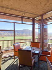 Sunroom featuring a mountain view
