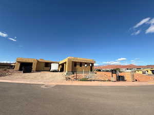 Property in mid-construction with a garage