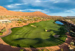 View of home's community featuring view of golf course, a residential view, and a water and mountain view