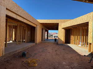 View of side of home with a patio area and stucco siding